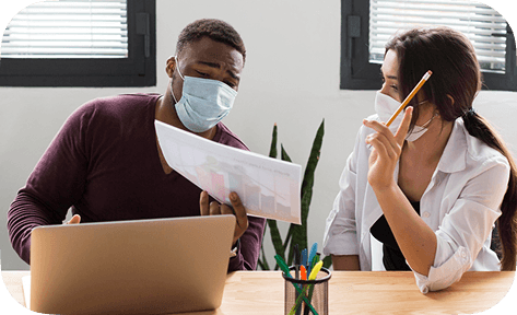 Two colleagues reviewing work together